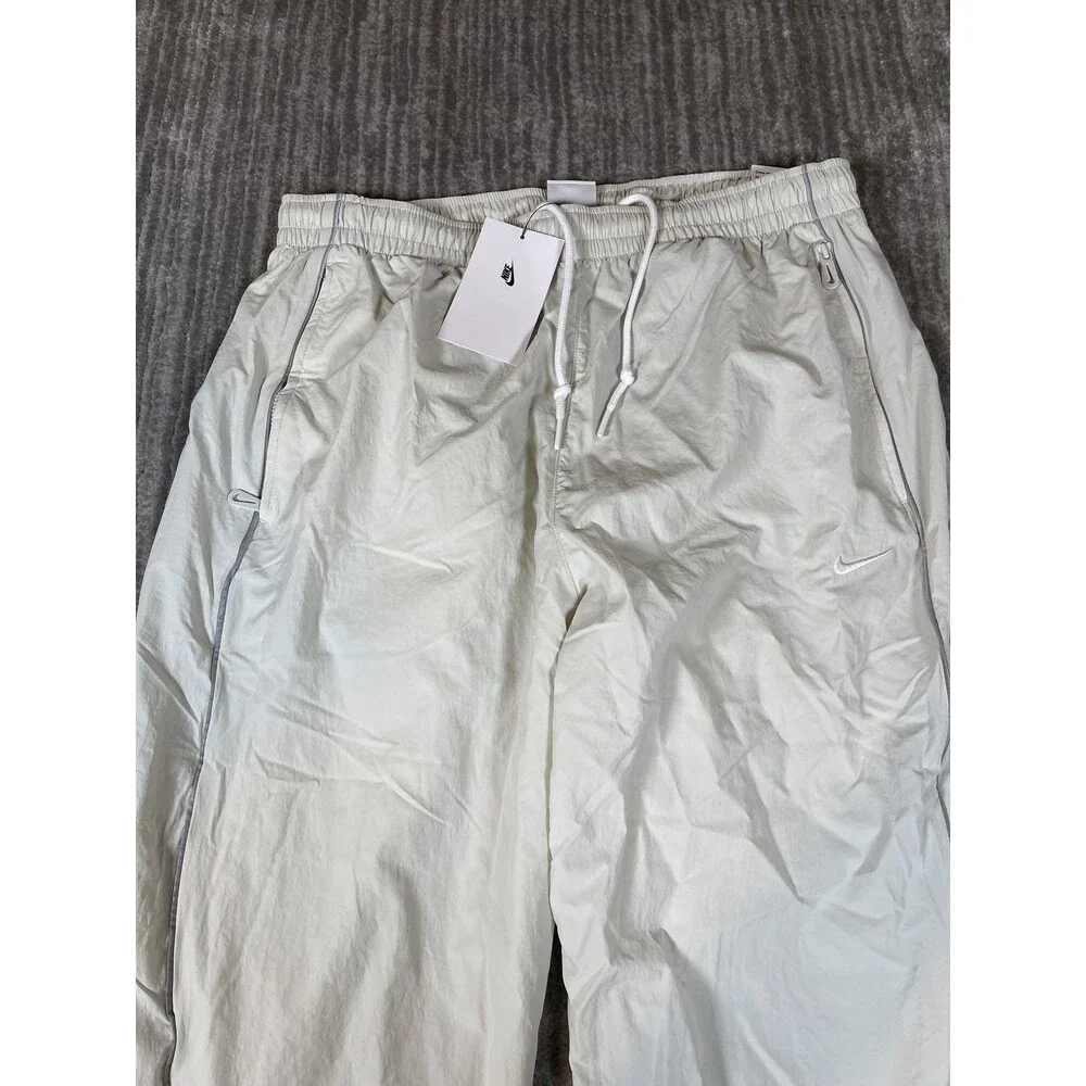 Nike Track Pants Mens Medium White Solo Swoosh Loose Fit Taper Leg Stacked New